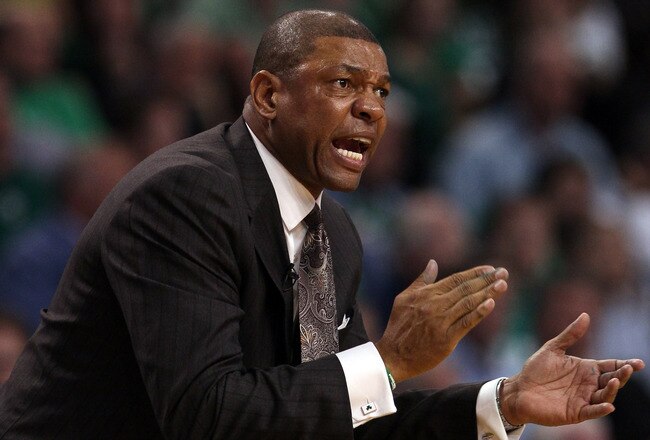 BOSTON, MA - MAY 09:  Head coach Doc Rivers of the Boston Celtics encourages his players in overtime against the Miami Heat in Game Four of the Eastern Conference Semifinals in the 2011 NBA Playoffs on May 9, 2011 at the TD Garden in Boston, Massachusetts.  The Miami Heat defeated the Boston Celtics 97-90 in overtime. NOTE TO USER: User expressly acknowledges and agrees that, by downloading and or using this photograph, User is consenting to the terms and conditions of the Getty Images License Agreement.  (Photo by Elsa/Getty Images)