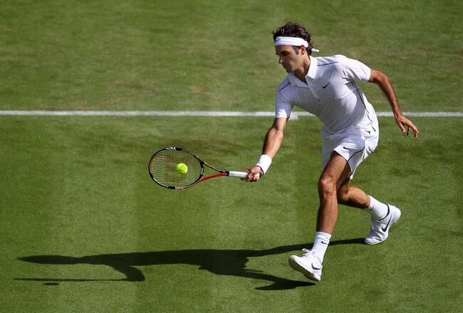 LONDON, ENGLAND - JUNE 21:  Roger Federer of Switzerland returns a shot during his first round match against Mikhail Kukushkin of Kazakhstan on Day Two of the Wimbledon Lawn Tennis Championships at the All England Lawn Tennis and Croquet Club on June 21, 2011 in London, England.  (Photo by Julian Finney/Getty Images)