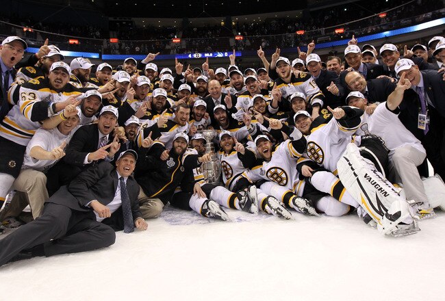 VANCOUVER, BC - JUNE 15:  The Boston Bruins pose with the Stanley Cup after defeating the Vancouver Canucks in Game Seven of the 2011 NHL Stanley Cup Final at Rogers Arena on June 15, 2011 in Vancouver, British Columbia, Canada. The Boston Bruins defeated the Vancouver Canucks 4 to 0.  (Photo by Bruce Bennett/Getty Images)