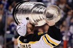 VANCOUVER, BC - JUNE 15:  Tim Thomas #30 of the Boston Bruins kisses the Stanley Cup after defeating the Vancouver Canucks in Game Seven of the 2011 NHL Stanley Cup Final at Rogers Arena on June 15, 2011 in Vancouver, British Columbia, Canada. The Boston Bruins defeated the Vancouver Canucks 4 to 0.  (Photo by Elsa/Getty Images)