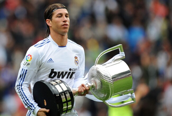 MADRID, SPAIN - APRIL 30: Sergio Ramos of Real Madrid walks away with the recently won Copa del Rey trophy before the La Liga match between Real Madrid and Real Zaragona at Estadio Santiago Bernabeu on April 30, 2011 in Madrid, Spain.  (Photo by Denis Doyle/Getty Images)