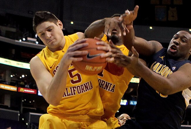 LOS ANGELES, CA - MARCH 10:  Nikola Vucevic #5 and Alex Stepheson #1 of the USC Trojans battle for a rebound with Markhuri Sanders-Frison #10 of the California Golden Bears in the second half in the quarterfinals of the 2011 Pacific Life Pac-10 Men's Basketball Tournament at Staples Center on March 10, 2011 in Los Angeles, California.  (Photo by Jeff Gross/Getty Images)