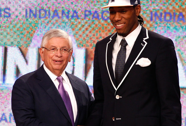 NEWARK, NJ - JUNE 23:  Kawhi Leonard from San Diego State greets NBA Commissioner David Stern after he was selected #15 overall by the Indiana Pacers in the first round during the 2011 NBA Draft at the Prudential Center on June 23, 2011 in Newark, New Jersey.  NOTE TO USER: User expressly acknowledges and agrees that, by downloading and/or using this Photograph, user is consenting to the terms and conditions of the Getty Images License Agreement.  (Photo by Mike Stobe/Getty Images)