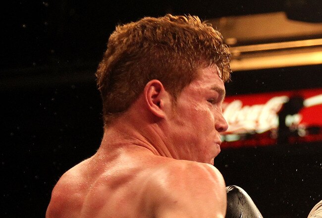 LAS VEGAS - MAY 01:  (L-R) Saul Alvarez of Mexico connects with a right to the body of Jose Miguel Cotto of Puerto Rico during the welterweight fight at the MGM Grand Garden Arena on May 1, 2010 in Las Vegas, Nevada.  (Photo by Jed Jacobsohn/Getty Images)