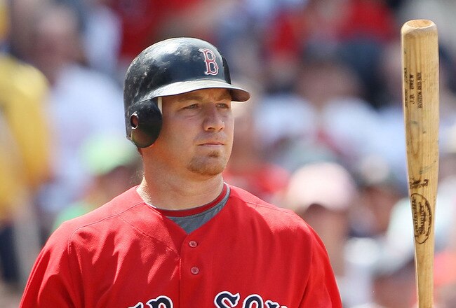 BOSTON - JULY 04:  J.D. Drew #7 of the Boston Red Sox heads back to the dugout after he struck out against the Baltimore Orioles on July 4, 2010 at Fenway Park in Boston, Massachusetts.  (Photo by Elsa/Getty Images)