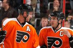 PHILADELPHIA, PA - FEBRUARY 03:  Jeff Carter #17 and Mike Richards #18 of the Philadelphia Flyers talk during a break in action in an NHL hockey game against the Nashville Predators at the Wells Fargo Center on February 3, 2011 in Philadelphia, Pennsylvania.  (Photo by Paul Bereswill/Getty Images)