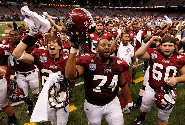 NEW ORLEANS, LA - DECEMBER 18:  Members of the Troy University Trojans celebrate after defeating the Ohio University Bobcats 48-21 during the R&L Carriers New Orleans Bowl at the Louisiana Superdome on December 18, 2010 in New Orleans, Louisiana.  (Photo by Chris Graythen/Getty Images)