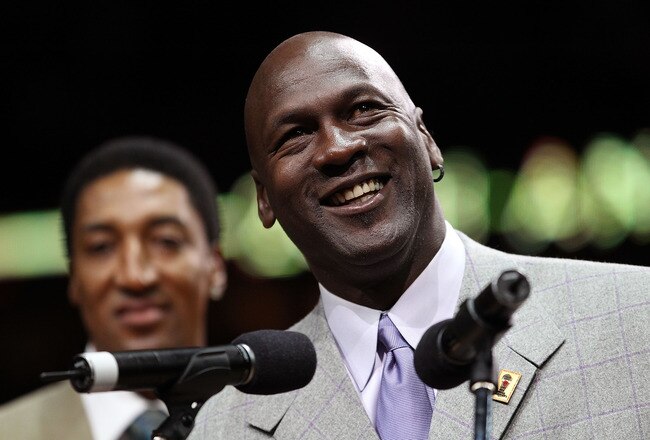 CHICAGO, IL - MARCH 12: Former player Michael Jordan of the Chicago Bulls addresses the crowd as teammate Scottie Pippen listens during a 20th anniversary recognition ceremony of the Bulls 1st NBA Championship in 1991 during half-time of a game bewteen the Bulls and the Utah Jazz at the United Center on March 12, 2011 in Chicago, Illinois. NOTE TO USER: User expressly acknowledges and agrees that, by downloading and/or using this photograph, User is consenting to the terms and conditions of the Getty Images License Agreement. (Photo by Jonathan Daniel/Getty Images)