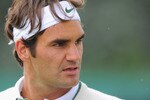 WIMBLEDON, ENGLAND - JUNE 19:  Roger Federer of Switzerland looks on during a training session ahead of the Wimbledon Lawn Tennis Championships on June 19, 2011 in Wimbledon, England.  (Photo by Michael Regan/Getty Images)