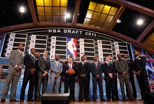 NEWARK, NJ - JUNE 23:  The 2011 Draft class including Kyrie Irving, Derrick Williams, Enes Kanter, Jonas Valanciunas, Brandon Knight, Jimmer Fredette and Kemba Walker pose for a group photo with NBA Commissioner David Stern (C) during the 2011 NBA Draft at the Prudential Center on June 23, 2011 in Newark, New Jersey.  NOTE TO USER: User expressly acknowledges and agrees that, by downloading and/or using this Photograph, user is consenting to the terms and conditions of the Getty Images License Agreement.  (Photo by Mike Stobe/Getty Images)