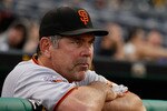 PITTSBURGH - APRIL 26:  Manager Bruce Bochy #15 of the San Francisco Giants watches the grounds crew prepare the field during a rain delay before the game against the Pittsburgh Pirates on April 26, 2011 at PNC Park in Pittsburgh, Pennsylvania.  (Photo by Jared Wickerham/Getty Images)