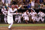 OMAHA, NE - JUNE 29:  Whit Merrifield #5 of the South Carolina Gamecocks celebrates after hitting the game winning RBI to defeat the UCLA Bruins in game 2 of the men's 2010 NCAA College Baseball World Series at Rosenblatt Stadium on June 29, 2010 in Omaha, Nebraska. The Gamecocks defeated the Bruins 2-1 in eleven innings to win the National Championship.  (Photo by Christian Petersen/Getty Images)