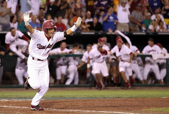 OMAHA, NE - JUNE 29:  Whit Merrifield #5 of the South Carolina Gamecocks celebrates after hitting the game winning RBI to defeat the UCLA Bruins in game 2 of the men's 2010 NCAA College Baseball World Series at Rosenblatt Stadium on June 29, 2010 in Omaha, Nebraska. The Gamecocks defeated the Bruins 2-1 in eleven innings to win the National Championship.  (Photo by Christian Petersen/Getty Images)