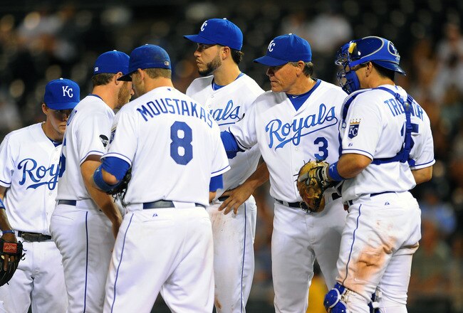 KANSAS CITY, MO - JUNE 23:  Manager Ned Yost #3 of the Kansas City Royals makes a pitching change during the ninth inning against the Arizona Diamondbacks at Kauffman Stadium on June 23, 2011 in Kansas City, Missouri. (Photo by G. Newman Lowrance/Getty Images)
