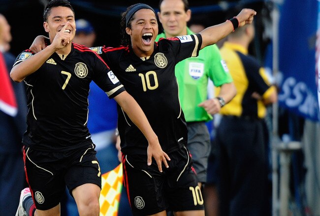 PASADENA, CA - JUNE 25:  Pablo Barrera #7 of Mexico celebrates his goal with Giovanni Dos Santos #10 against the United States during the 2011 CONCACAF Gold Cup Championship at the Rose Bowl on June 25, 2011 in Pasadena, California.  (Photo by Kevork Djansezian/Getty Images)