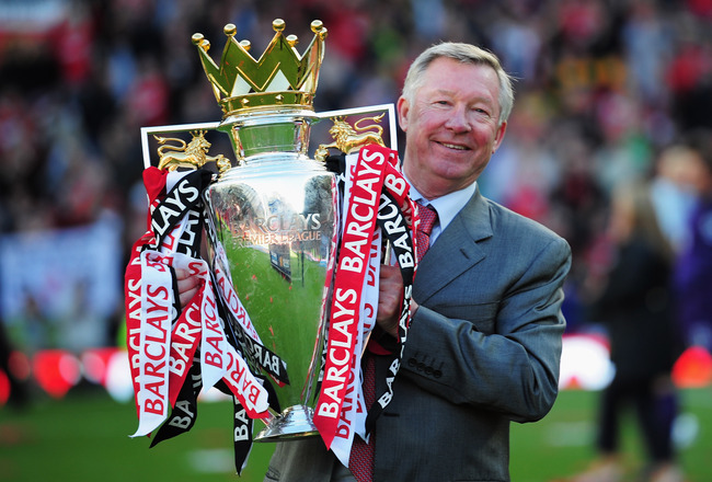 MANCHESTER, ENGLAND - MAY 22:  Sir Alex Ferguson manager of Manchester United lifts the Premier League trophy after the Barclays Premier League match between Manchester United and Blackpool at Old Trafford on May 22, 2011 in Manchester, England. Manchester United celebrate a record 19th league championship.  (Photo by Shaun Botterill/Getty Images)