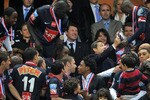 PARIS - MAY 01:  Paris Saint Germain football club midfielder and captain Claude Makelele ( R) receives the cup from French President Nicolas Sarkozy after winning the French football Cup final between Paris Saint Germain and A.S Monaco at Stade de France on May 1, 2010 in Paris, France. Paris Saint Germain won 1-0.  (Photo by Pascal Le Segretain/Getty Images)