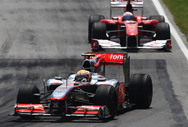MONTREAL - JUNE 13:  Lewis Hamilton of Great Britain and McLaren Mercedes leads from Fernando Alonso of Spain and Ferrari during the Canadian Formula One Grand Prix at the Circuit Gilles Villeneuve on June 13, 2010 in Montreal, Canada.  (Photo by Bryn Lennon/Getty Images)