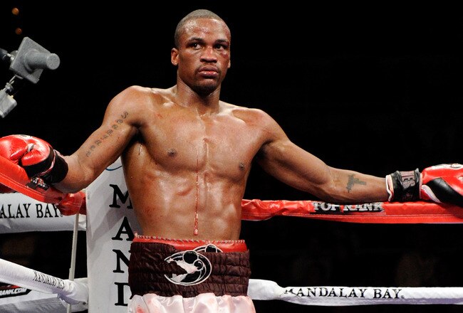 LAS VEGAS, NV - FEBRUARY 19:  Mike Jones of Philadelphia waits in a neutral corner of the ring as a doctor checks on Jesus Soto-Karass of Mexico during their welterweight bout at the Mandalay Bay Events Center February 19, 2011 in Las Vegas, Nevada. Jones won by unanimous decision.  (Photo by Ethan Miller/Getty Images)