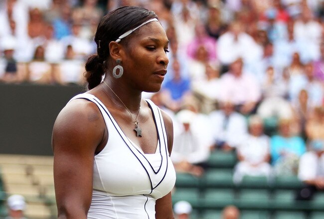 LONDON, ENGLAND - JUNE 27:  Serena Williams of the United States reacts to a play during her fourth round match against  Marion Bartoli of France on Day Seven of the Wimbledon Lawn Tennis Championships at the All England Lawn Tennis and Croquet Club on June 27, 2011 in London, England.  (Photo by Clive Brunskill/Getty Images)