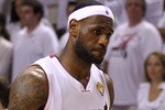 MIAMI, FL - JUNE 12:  LeBron James #6 of the Miami Heat looks on dejected against the Dallas Mavericks in Game Six of the 2011 NBA Finals at American Airlines Arena on June 12, 2011 in Miami, Florida. NOTE TO USER: User expressly acknowledges and agrees that, by downloading and/or using this Photograph, user is consenting to the terms and conditions of the Getty Images License Agreement.  (Photo by Mike Ehrmann/Getty Images)