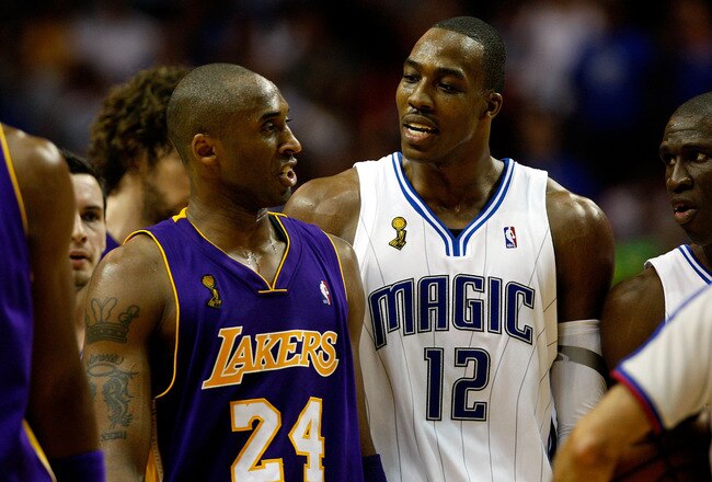 ORLANDO, FL - JUNE 11:  Kobe Bryant #24 of the Los Angeles Lakers and Dwight Howard #12 of the Orlando Magic exchange words in the second half of Game Four of the 2009 NBA Finals on June 11, 2009 at Amway Arena in Orlando, Florida.  NOTE TO USER:  User expressly acknowledges and agrees that, by downloading and or using this photograph, User is consenting to the terms and conditions of the Getty Images License Agreement.  (Photo by Chris Graythen/Getty Images)