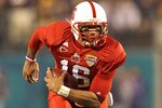 ORLANDO, FL - DECEMBER 28:  Russell Wilson #16 of the North Carolina State Wolfpack passes the ball during the Champs Sports Bowl against the West Virginia Mountineers at Florida Citrus Bowl Stadium on December 28, 2010 in Orlando, Florida.  (Photo by Mike Ehrmann/Getty Images)
