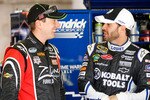 FORT WORTH, TX - APRIL 08:  Kyle Busch (L), driver of the #18 Interstate Batteries Toyota, talks with Jimmie Johnson (R), driver of the #48 Lowe's/Kobalt Tools Chevrolet, in the garage during practice for the NASCAR Sprint Cup Series Samsung Mobile 500 at Texas Motor Speedway on April 8, 2011 in Fort Worth, Texas.  (Photo by Matthew Stockman/Getty Images)