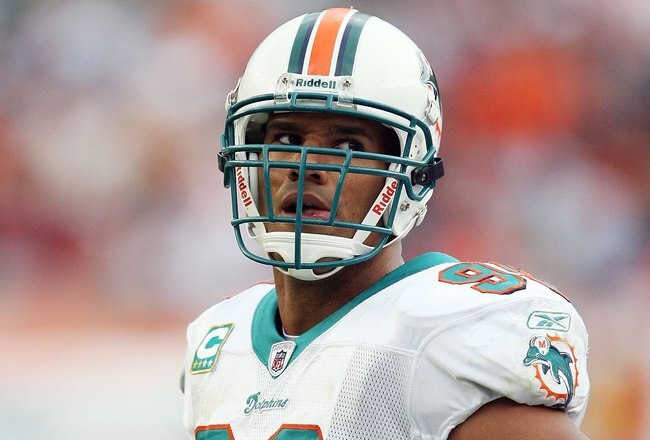 MIAMI - DECEMBER 06:  Linebacker Jason Taylor #99 of the Miami Dolphins watches from the sideline during his team's game-winning drive against the New England Patriots at Land Shark Stadium on December 6, 2009 in Miami, Florida.  (Photo by Doug Benc/Getty Images)