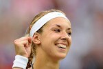 LONDON, ENGLAND - JUNE 28:  Sabine Lisicki of Germany celebrates after winning her quarterfinal round match against Marion Bartoli of France on Day Eight of the Wimbledon Lawn Tennis Championships at the All England Lawn Tennis and Croquet Club on June 28, 2011 in London, England.  (Photo by Clive Mason/Getty Images)