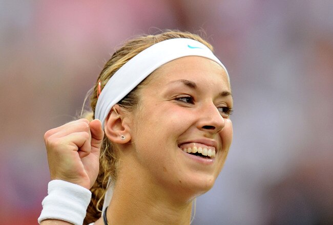 LONDON, ENGLAND - JUNE 28:  Sabine Lisicki of Germany celebrates after winning her quarterfinal round match against Marion Bartoli of France on Day Eight of the Wimbledon Lawn Tennis Championships at the All England Lawn Tennis and Croquet Club on June 28, 2011 in London, England.  (Photo by Clive Mason/Getty Images)