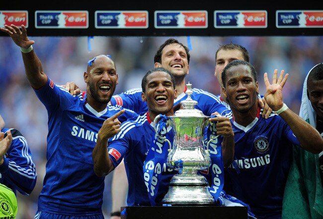 LONDON, ENGLAND - MAY 15:  Nicolas Anelka (L), Didier Drogba (R) and Florent Malouda (C) of Chelsea celebrate winning the FA Cup sponsored by E.ON Final match between Chelsea and Portsmouth at Wembley Stadium on May 15, 2010 in London, England.  (Photo by Shaun Botterill/Getty Images)