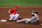 WASHINGTON, DC - JUNE 19: Second basemen Danny Espinosa #18 of the Washington Nationals tries to tag out Nolan Reimold #14 of the Baltimore Orioles after he steals in the seventh inning at Nationals Park on June 19, 2011 in Washington, DC. The Baltimore Orioles won, 7-4. (Photo by Patrick Smith/Getty Images)