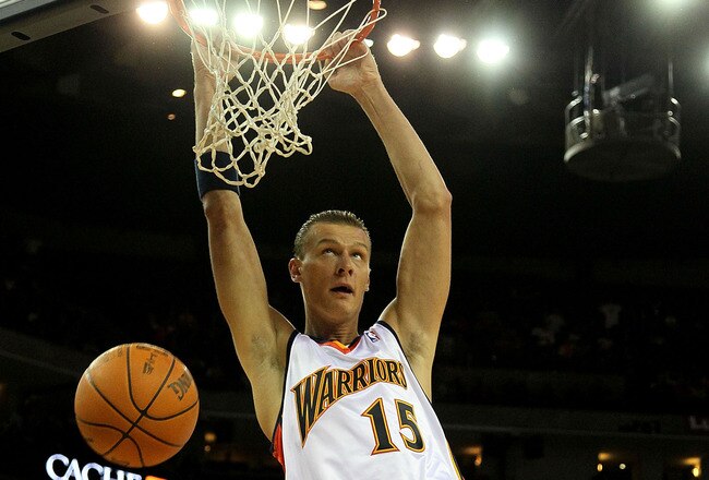 OAKLAND, CA - FEBRUARY 21:  Andris Biedrins #15 of the Golden State Warriors shoots against Josh Smith #5 of the Atlanta Hawks during an NBA game at Oracle Arena on February 21, 2010 in Oakland, California.  NOTE TO USER: User expressly acknowledges and agrees that, by downloading and/or using this Photograph, user is consenting to the terms and conditions of the Getty Images License Agreement.  (Photo by Jed Jacobsohn/Getty Images)