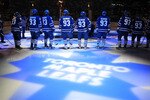 TORONTO - JANUARY 31:  Members of the Toronto Maple Leafs stand on the blue line wearing the #93 to honor Doug Gilmour as he has his #93 jersey raised to the rafters prior to facing the Pittsburgh Penguins during their NHL game at the Air Canada Centre January 31, 2009 in Toronto, Canada. (Photo by Dave Sandford/Getty Images)