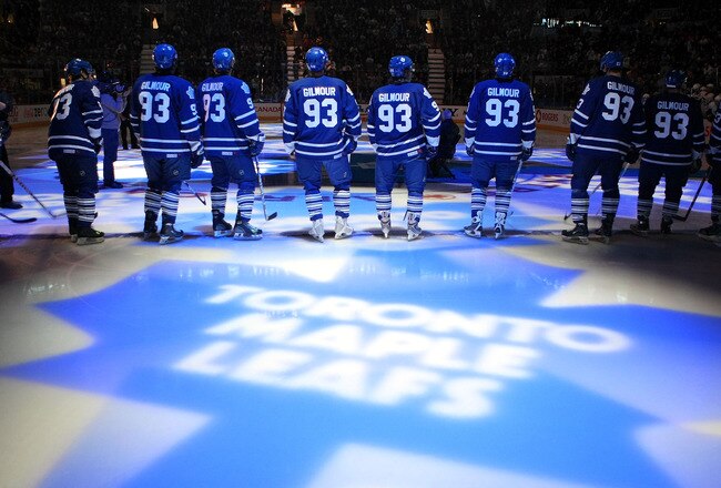 TORONTO - JANUARY 31:  Members of the Toronto Maple Leafs stand on the blue line wearing the #93 to honor Doug Gilmour as he has his #93 jersey raised to the rafters prior to facing the Pittsburgh Penguins during their NHL game at the Air Canada Centre January 31, 2009 in Toronto, Canada. (Photo by Dave Sandford/Getty Images)