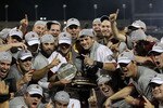 OMAHA, NE - JUNE 28:  (L-R) Brady Thomas #36 and Scott Wingo #8 of the South Carolina Gamecocks celebrate with the team while holding the trophy after winning the men's 2011 NCAA College Baseball World Series at TD Ameritrade Park Omaha on June 28, 2011 in Omaha, Nebraska.  The Gamecocks defeated the Florida Gators 5-2 and won the series 2-0.  (Photo by Ronald Martinez/Getty Images)
