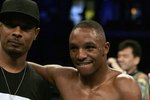 ST. LOUIS - JULY 8:  Trainer Kevin Cunningham (L) celebrates with Devon Alexander after Alexander defeated Tyler Ziolkowski by TKO in the first round on July 8, 2006 at the Savvis Center in St. Louis, Missouri.  (Photo by Elsa/Getty Images)