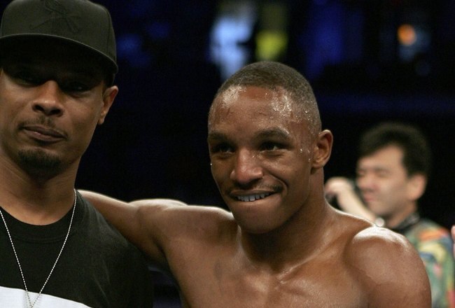 ST. LOUIS - JULY 8:  Trainer Kevin Cunningham (L) celebrates with Devon Alexander after Alexander defeated Tyler Ziolkowski by TKO in the first round on July 8, 2006 at the Savvis Center in St. Louis, Missouri.  (Photo by Elsa/Getty Images)