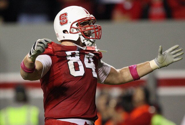 RALEIGH, NC - OCTOBER 28:  George Bryan #84 of the North Carolina State Wolfpack celebrates on his way to defeating the Florida State Seminoles 28-24 during their game at Carter-Finley Stadium on October 28, 2010 in Raleigh, North Carolina.  (Photo by Streeter Lecka/Getty Images)