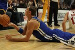 CHICAGO - NOVEMBER 11: Andris Biedrins #15 of the Golden State Warriors hands the ball off to a teammate after a scramble on the floor against the Chicago Bulls at the United Center on November 11, 2010 in Chicago, Illinois. NOTE TO USER: User expressly acknowledges and agrees that, by downloading and/or using this Photograph, User is consenting to the terms and conditions of the Getty Images License Agreement. (Photo by Jonathan Daniel/Getty Images)