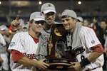 OMAHA, NE - JUNE 28:  (L-R) Brady Thomas #36, Michael Roth #29 and Scott Wingo #8 of the South Carolina Gamecocks celebrate with the trophy after winning the men's 2011 NCAA College Baseball World Series at TD Ameritrade Park Omaha on June 28, 2011 in Omaha, Nebraska.  The Gamecocks defeated the Florida Gators 5-2 and won the series 2-0.  (Photo by Ronald Martinez/Getty Images)