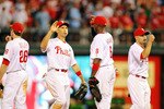 PHILADELPHIA - JUNE 29:  Raul Ibanez #29 and Ryan Howard #6 of the Philadelphia Phillies celebrate a 2-1 win against the Boston Red Sox at Citizens Bank Park on June 29, 2011 in Philadelphia, Pennsylvania.  (Photo by Len Redkoles/Getty Images)