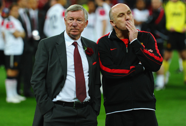 LONDON, ENGLAND - MAY 28:  Sir Alex Ferguson manager of Manchester United (L) and Mike Phelan assistant manager of Manchester United show their dejection after the UEFA Champions League final between FC Barcelona and Manchester United FC at Wembley Stadium on May 28, 2011 in London, England.  (Photo by Laurence Griffiths/Getty Images)