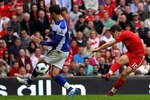 LIVERPOOL, ENGLAND - APRIL 23:  Joe Cole of Liverpool scores his team's fifth goal during the Barclays Premier League match between Liverpool and Birmingham City at Anfield on April 23, 2011 in Liverpool, England.  (Photo by Clive Brunskill/Getty Images)