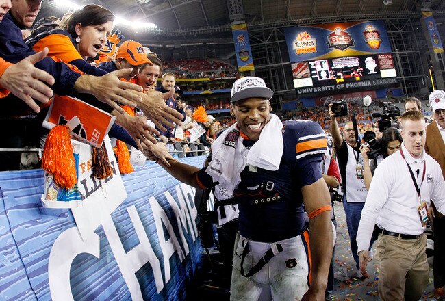 GLENDALE, AZ - JANUARY 10:  Quarterback Cameron Newton #2 of the Auburn Tigers celebrates the Tigers 22-19 victory against the Oregon Ducks in the Tostitos BCS National Championship Game at University of Phoenix Stadium on January 10, 2011 in Glendale, Arizona.  (Photo by Kevin C. Cox/Getty Images)
