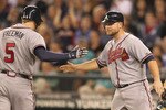SEATTLE - JUNE 27:  Freddie Freeman #5 of the Atlanta Braves is congratulated by Brian McCann #16 after hitting a two run homer in the seventh inning against the Seattle Mariners at Safeco Field on June 27, 2011 in Seattle, Washington. (Photo by Otto Greule Jr/Getty Images)