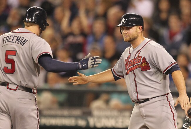 SEATTLE - JUNE 27:  Freddie Freeman #5 of the Atlanta Braves is congratulated by Brian McCann #16 after hitting a two run homer in the seventh inning against the Seattle Mariners at Safeco Field on June 27, 2011 in Seattle, Washington. (Photo by Otto Greule Jr/Getty Images)
