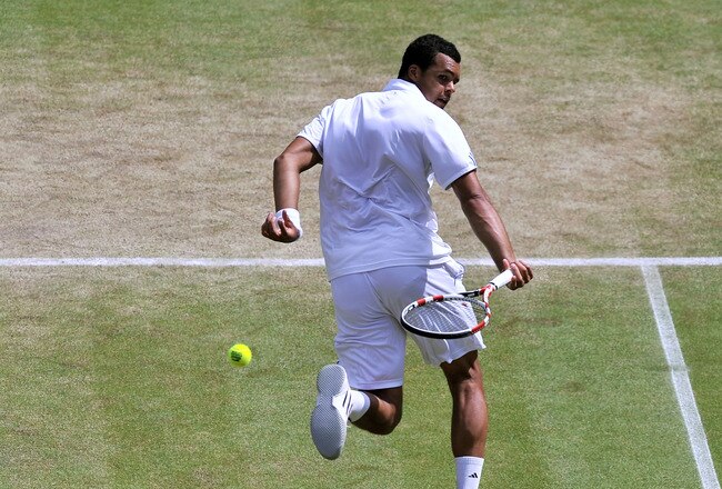 LONDON, ENGLAND - JULY 01:  Jo-Wilfried Tsonga of France returns a shot during his semifinal round match against Novak Djokovic of Serbia on Day Eleven of the Wimbledon Lawn Tennis Championships at the All England Lawn Tennis and Croquet Club on July 1, 2011 in London, England.  (Photo by Carl de Souza/Pool/Getty Images)