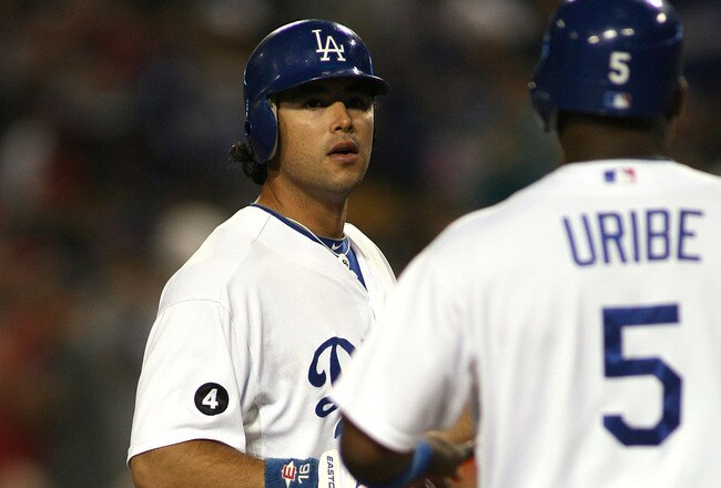 LOS ANGELES, CA - JUNE 21:  Andre Ethier #16 of the Los Angeles Dodgers touches home plate as he looks toward teammate Juan Uribe #5, who scored ahead of him, after hitting a two-run home run against the Detroit Tigers in the fifth inning of the game at Dodger Stadium on June 21, 2011 in Los Angeles, California.  (Photo by Jeff Golden/Getty Images)